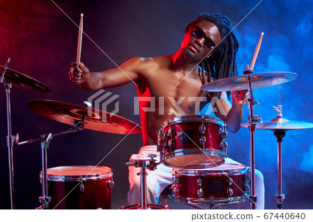 modern stylish african man playing on drums modern stylish african man playing on drums 67440640