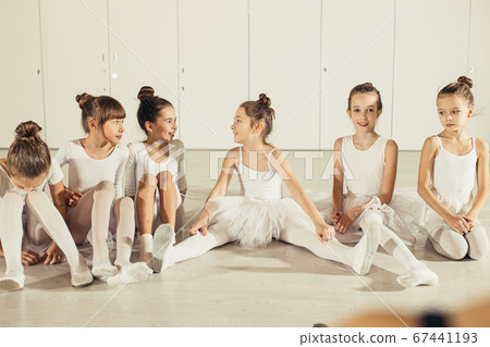 group of funny and happy children ballerinas sitting on floor group of funny and happy children ballerinas sitting on floor 67441193