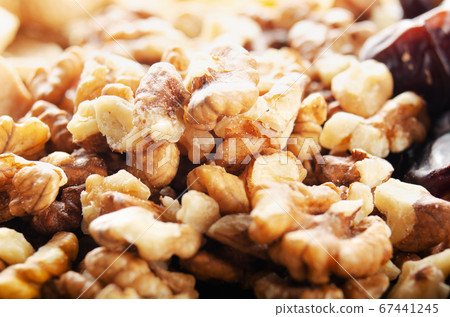 Closeup view at walnut nuts on kitchen table. 67441245