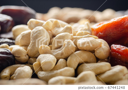 Closeup view at cashew nuts on kitchen table. 67441248