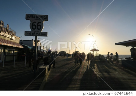 California Santa Monica Route 66 sign and sunset 67441644
