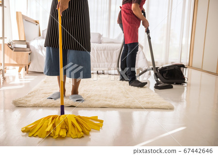 Clean bedroom by mop and vacuum cleaner 67442646