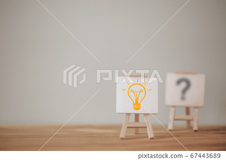 Outstanding sign stand with a light bulb icon and question mark symbol. Concept creative idea and innovation. Organization resource and talent management Outstanding sign stand with a light bulb icon and question mark symbol. Concept creative idea and innovation. Organization resource and talent management 67443689