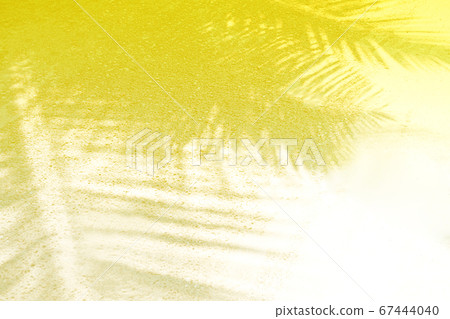 Palm leaf shadows on a white sand on tropical beach. Palm leaf shadows on a white sand on tropical beach. 67444040