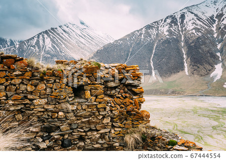 Fortress On Mountain Background Near Karatkau Village, Kazbegi District, Mtskheta-Mtianeti Region, Georgia. Spring, Summer Season. Truso Gorge. 67444554