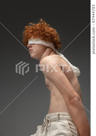 Portrait of beautiful redhead man isolated on grey studio background. Concept of beauty, skin care, fashion and style 67444783