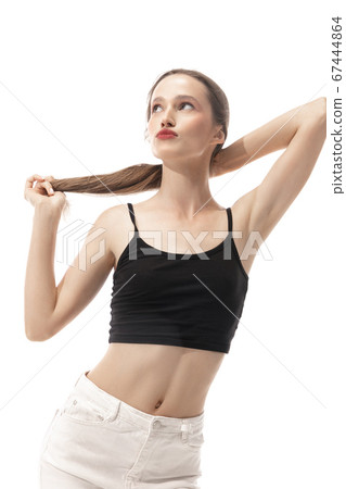 Portrait of beautiful young woman isolated on white studio background. Concept of beauty, skin care, fashion and style Portrait of beautiful young woman isolated on white studio background. Concept of beauty, skin care, fashion and style 67444864