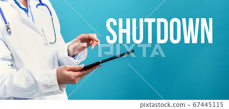 Shutdown theme with a doctor using a tablet Shutdown theme with a doctor using a tablet 67445115