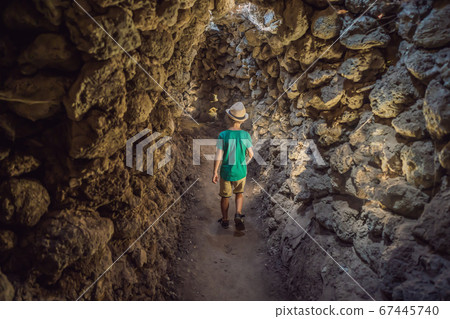 Boy tourist in Chua Tu Van temple made of shells and corals or the dragon maze. Travel to Vietnam Concept. Traveling with children concept 67445740