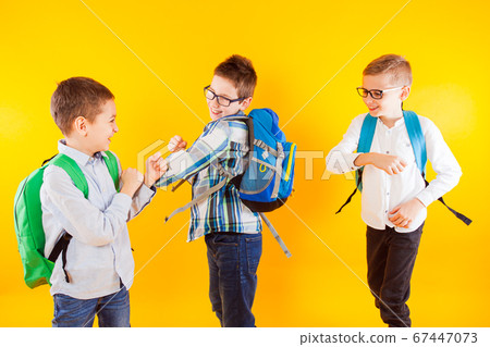 The schoolboys are easily pushed to greet each other The schoolboys are easily pushed to greet each other 67447073