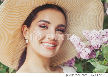 Happi lovely woman with flowers outdoor Happi lovely woman with flowers outdoor 67447736