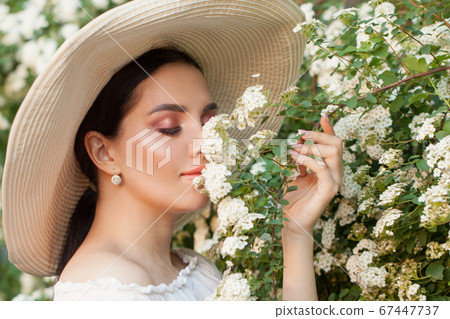Lovely girl with flowers outdoor portrait Lovely girl with flowers outdoor portrait 67447737