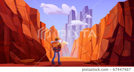 Hiker man with map on desert road in canyon Hiker man with map on desert road in canyon 67447987