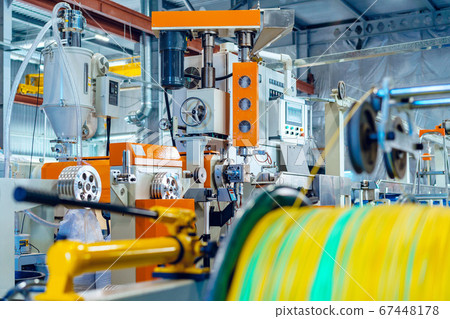 Cable production in process. Cable factory close up Cable production in process. Cable factory close up 67448178