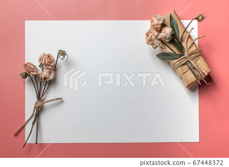 Flowers composition. Workspace with small bouquet and gift Top view, flat lay Flowers composition. Workspace with small bouquet and gift Top view, flat lay 67448372