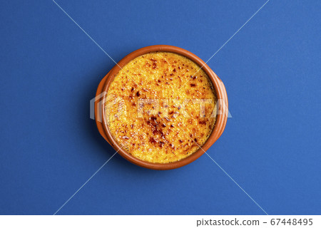 Creme brulee in clay tray top view. Burned cream 67448495