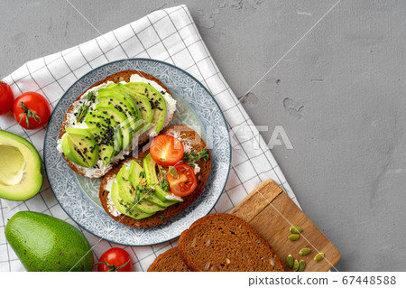 Toasted avocado sandwich for breakfast, top view 67448588