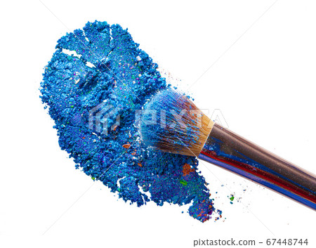 Crushed eyeshadows with brush isolated on white background. Crushed eyeshadows with brush isolated on white background. 67448744