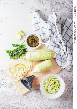 Zucchini Spaghetti on light background Zucchini Spaghetti on light background 67448929