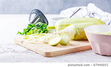 Zucchini Spaghetti on light background Zucchini Spaghetti on light background 67448931