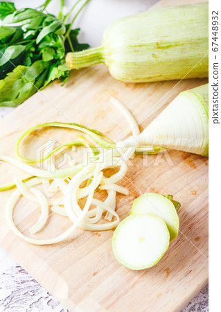 Zucchini Spaghetti on light background Zucchini Spaghetti on light background 67448932