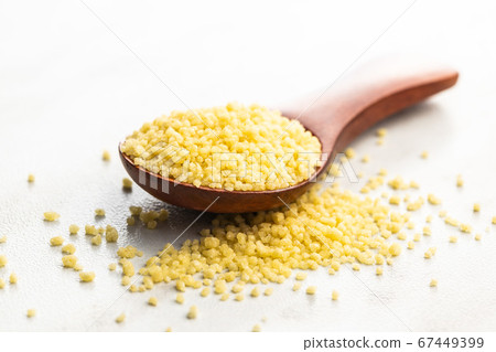 Dry yellow couscous Dry yellow couscous 67449399