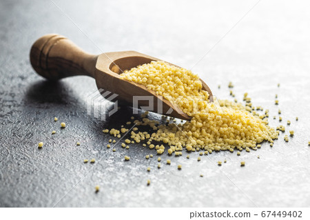 Dry yellow couscous Dry yellow couscous 67449402