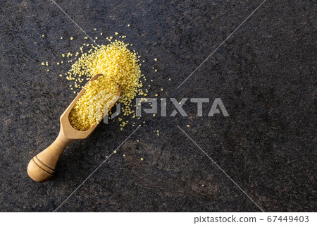 Dry yellow couscous Dry yellow couscous 67449403