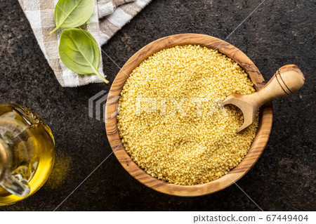 Dry yellow couscous Dry yellow couscous 67449404