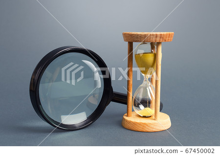 Magnifying glass and hourglass. Limited Search Concept. Find free time. Subscription, paid plan. Seek in short time. Speed and efficiency. Deadline Magnifying glass and hourglass. Limited Search Concept. Find free time. Subscription, paid plan. Seek in short time. Speed and efficiency. Deadline 67450002