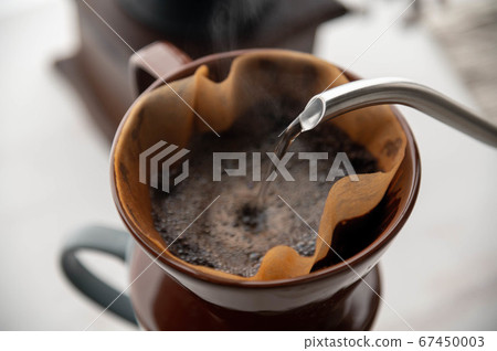 dripping coffee image with mug , paper filter and 67450003