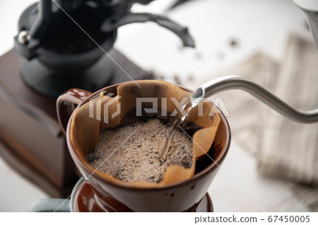 dripping coffee image with mug , paper filter and 67450005