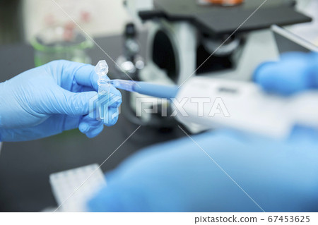 Researcher's research and development image using a micropipette 67453625