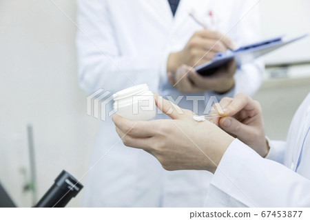 Female researcher who develops hand cream, cosmetics product development department Female researcher who develops hand cream, cosmetics product development department 67453877