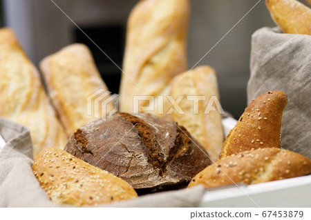 loaves of bread at a bakery shop loaves of bread at a bakery shop 67453879
