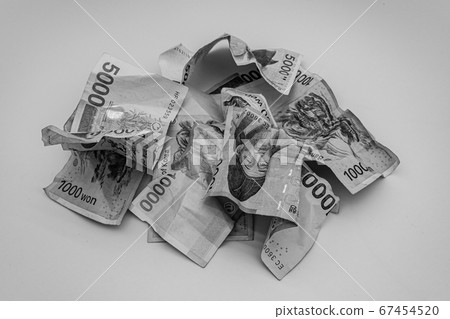 Crumpled currencies (black and white photo) 67454520