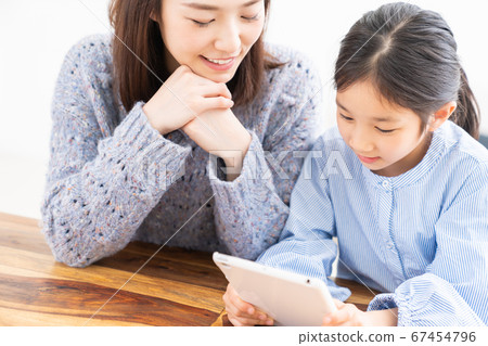 Parent and child and tablet Parent and child and tablet 67454796