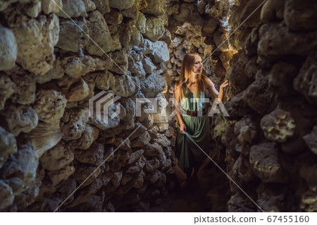 Woman tourist in Chua Tu Van temple made of shells and corals or the dragon maze. Travel to Vietnam Concept Woman tourist in Chua Tu Van temple made of shells and corals or the dragon maze. Travel to Vietnam Concept 67455160