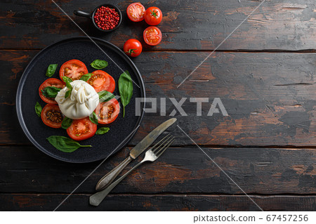 Burrata, Italian fresh cheese made from cream and 67457256