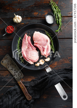 Fresh raw pork meat on frying grill pan with 67457306
