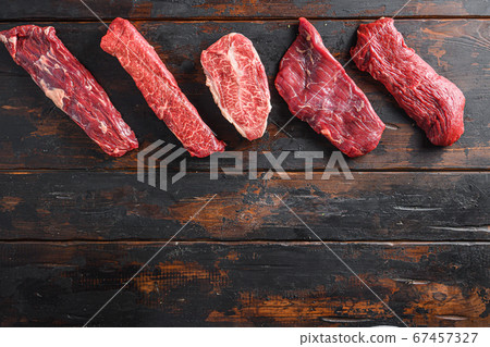 A set of different types of raw beef steaks 67457327