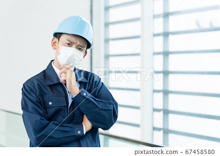 Workers wearing masks measures against infectious diseases 67458580