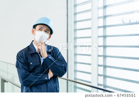 Workers wearing masks measures against infectious diseases 67458581