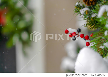 Holiday decoration with faux berries and leaves 67458597