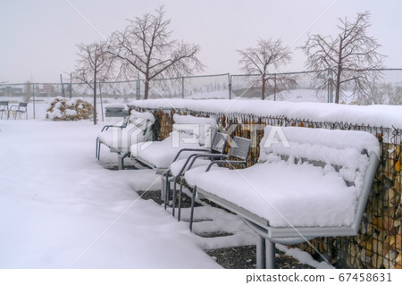 Frosty benches against a winter landscape in Utah Frosty benches against a winter landscape in Utah 67458631
