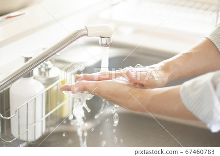 Hand of senior doing hand washing