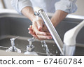 Hand of senior doing hand washing 67460784