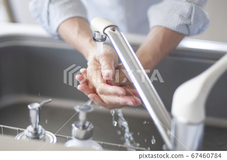 Hand of senior doing hand washing Hand of senior doing hand washing 67460784