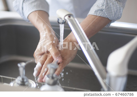 Hand of senior doing hand washing 67460786
