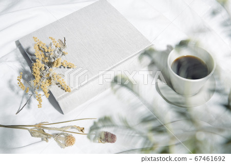 Windowsill with white cloth and coffee cup 67461692
